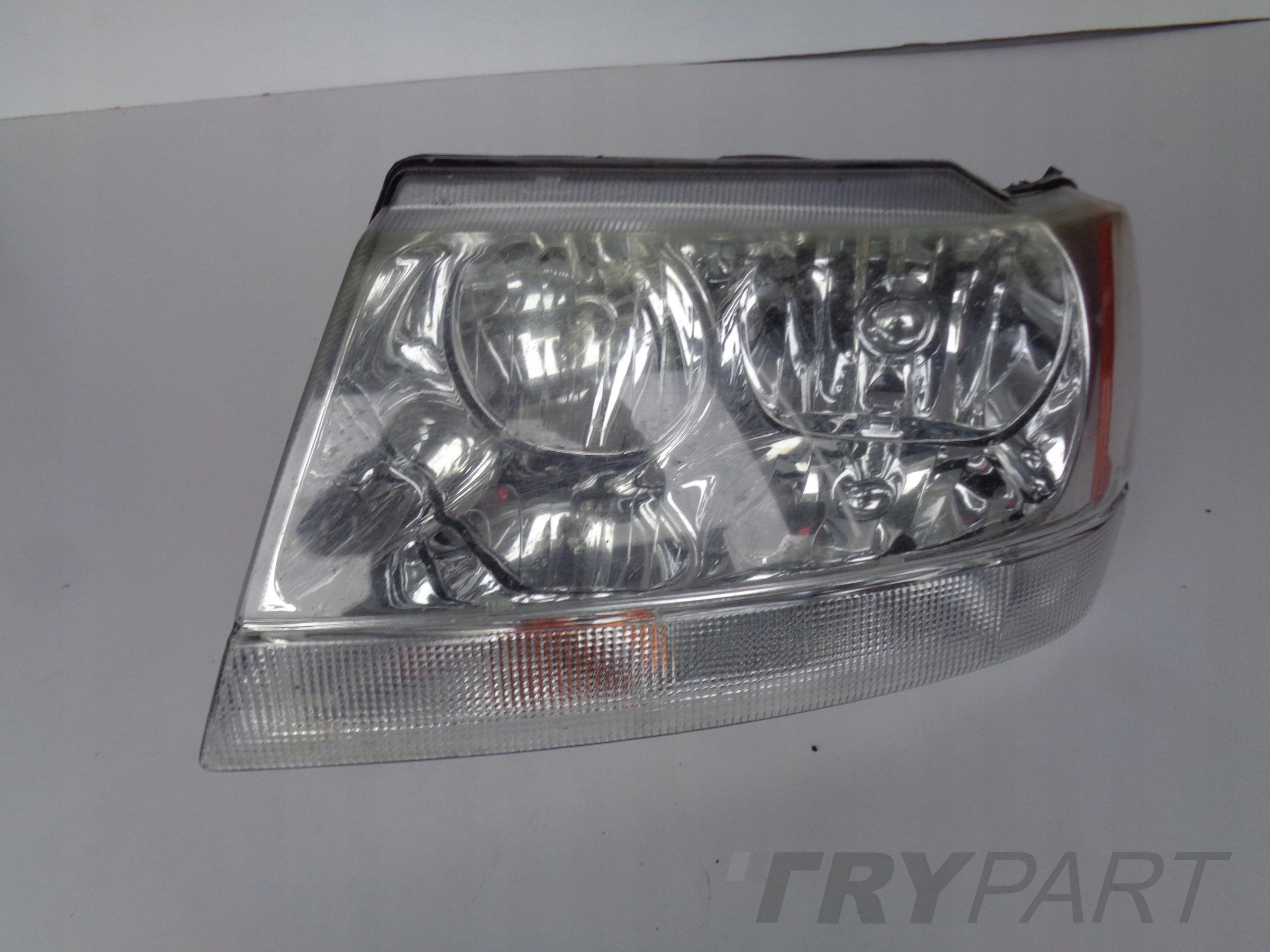 LEFT HEADLIGHT LAMP JEEP CHEROKEE 99-04